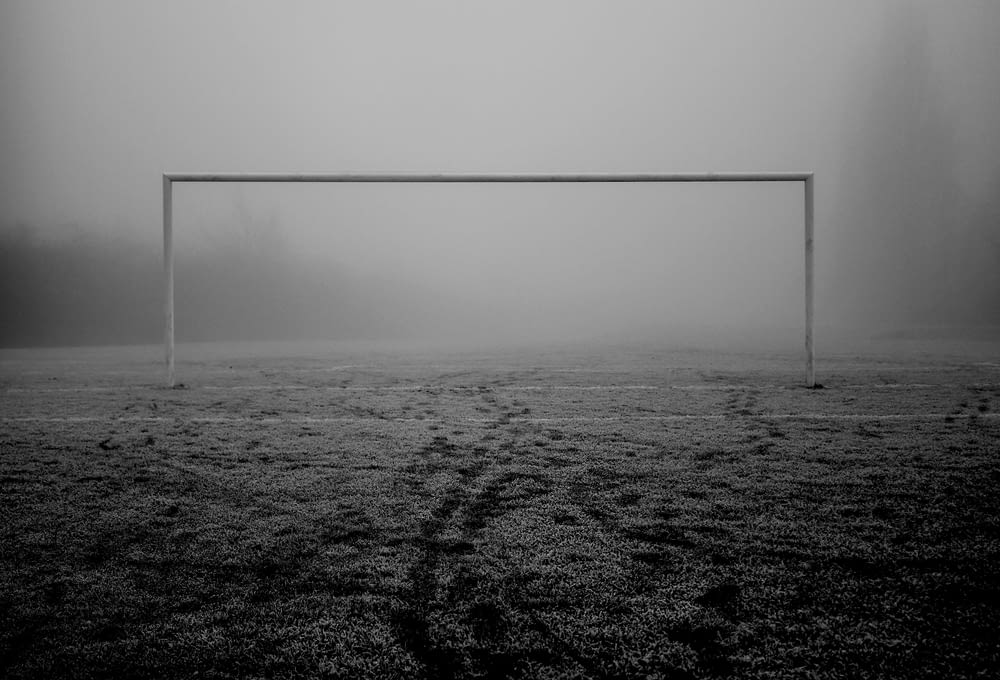 a soccer goal in the middle of a field