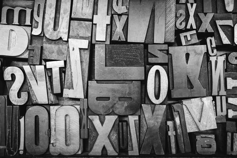 a black and white photo of letters and numbers