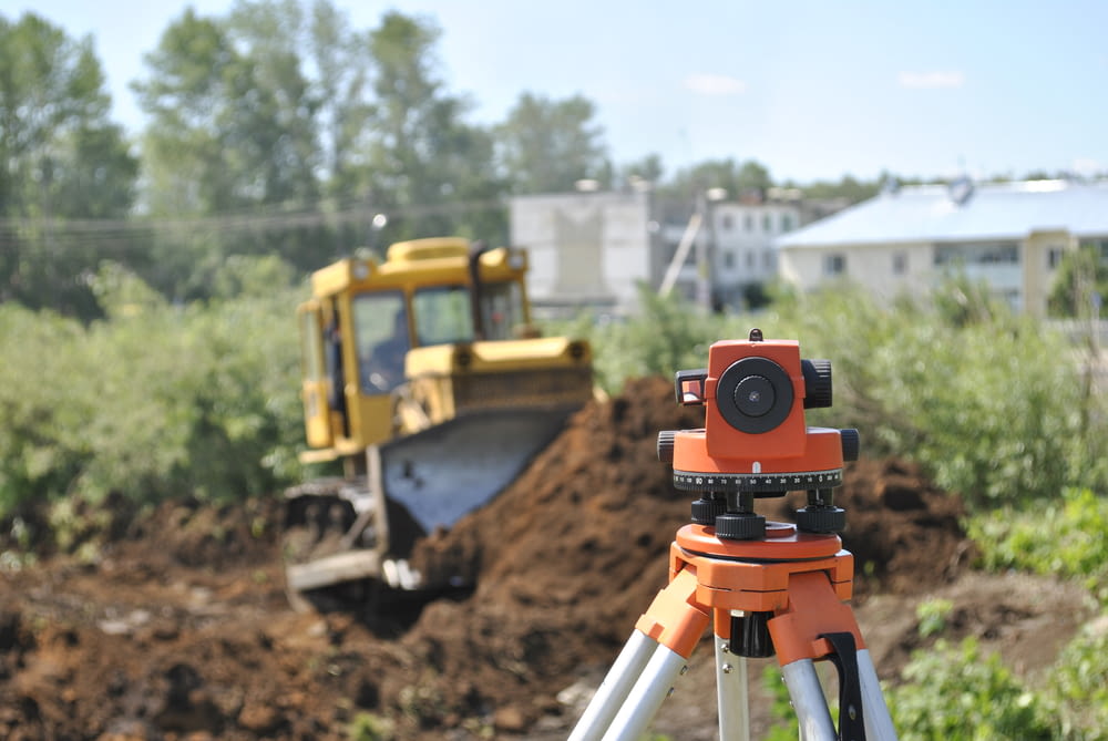 a construction site with a camera on a tripod