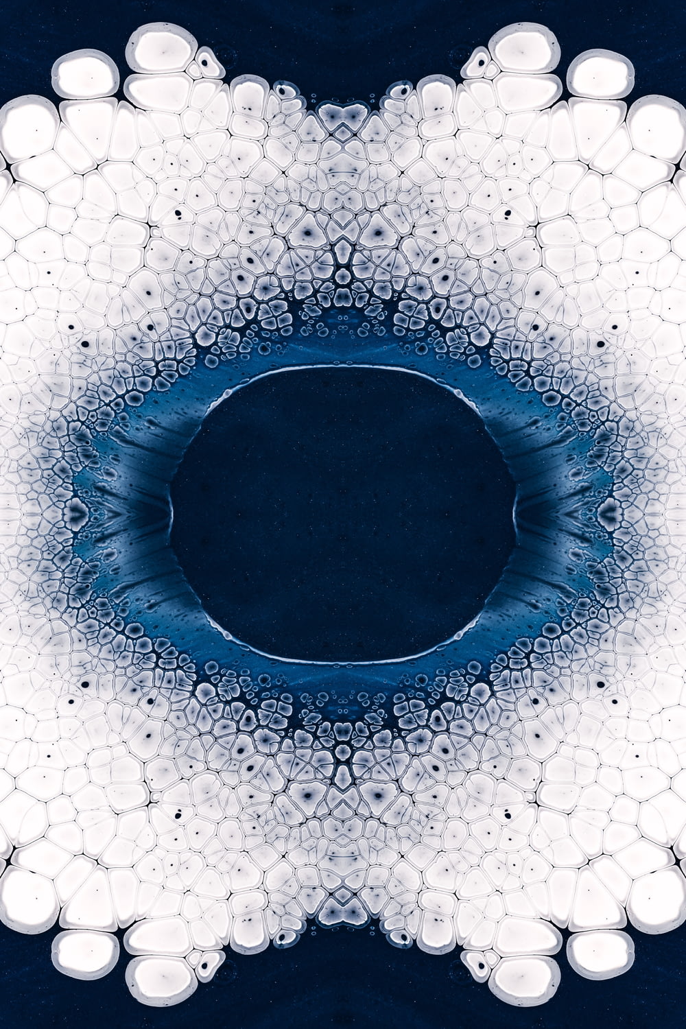 a blue and white circular design with bubbles