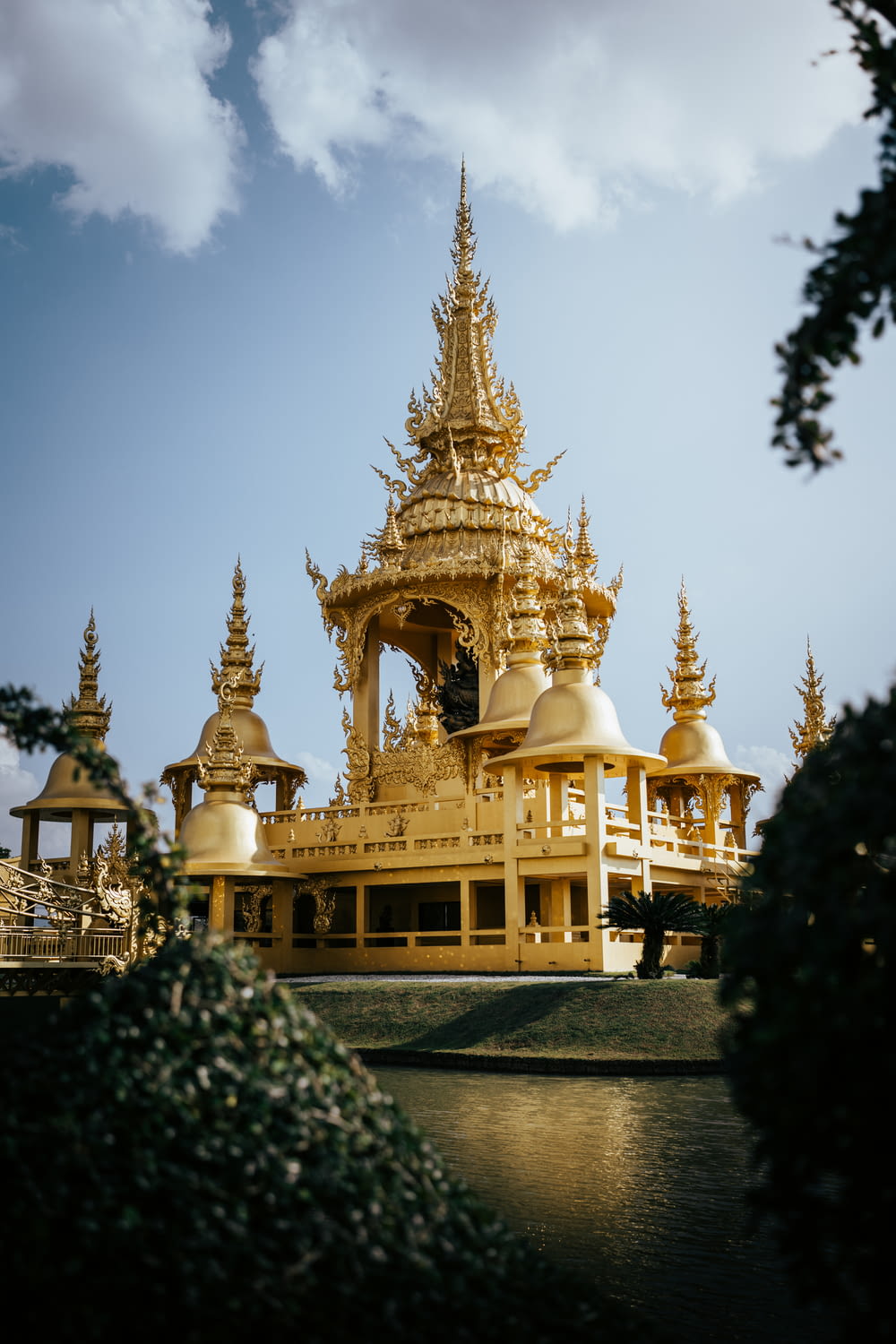 a golden building with many spires on top of it