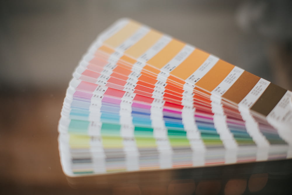 a close up of a pan of color samples
