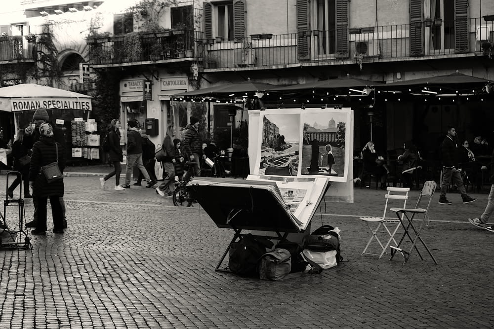 a black and white photo of people on a street