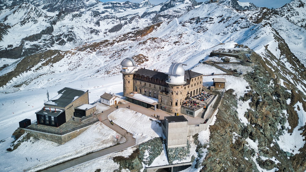an aerial view of a castle in the mountains