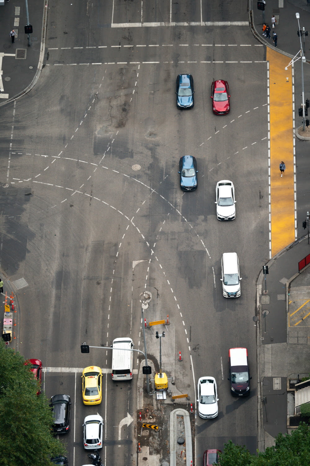 an overhead view of a street with cars and trucks