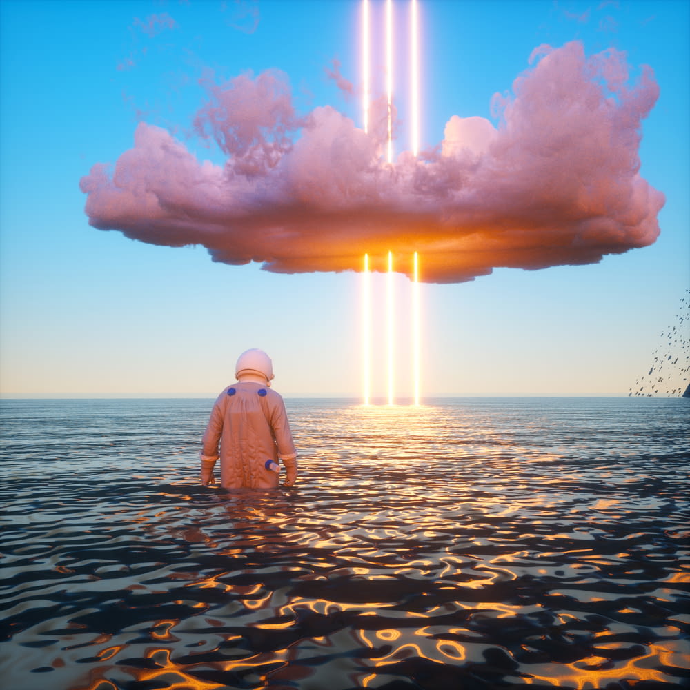 a person standing in a body of water under a large cloud