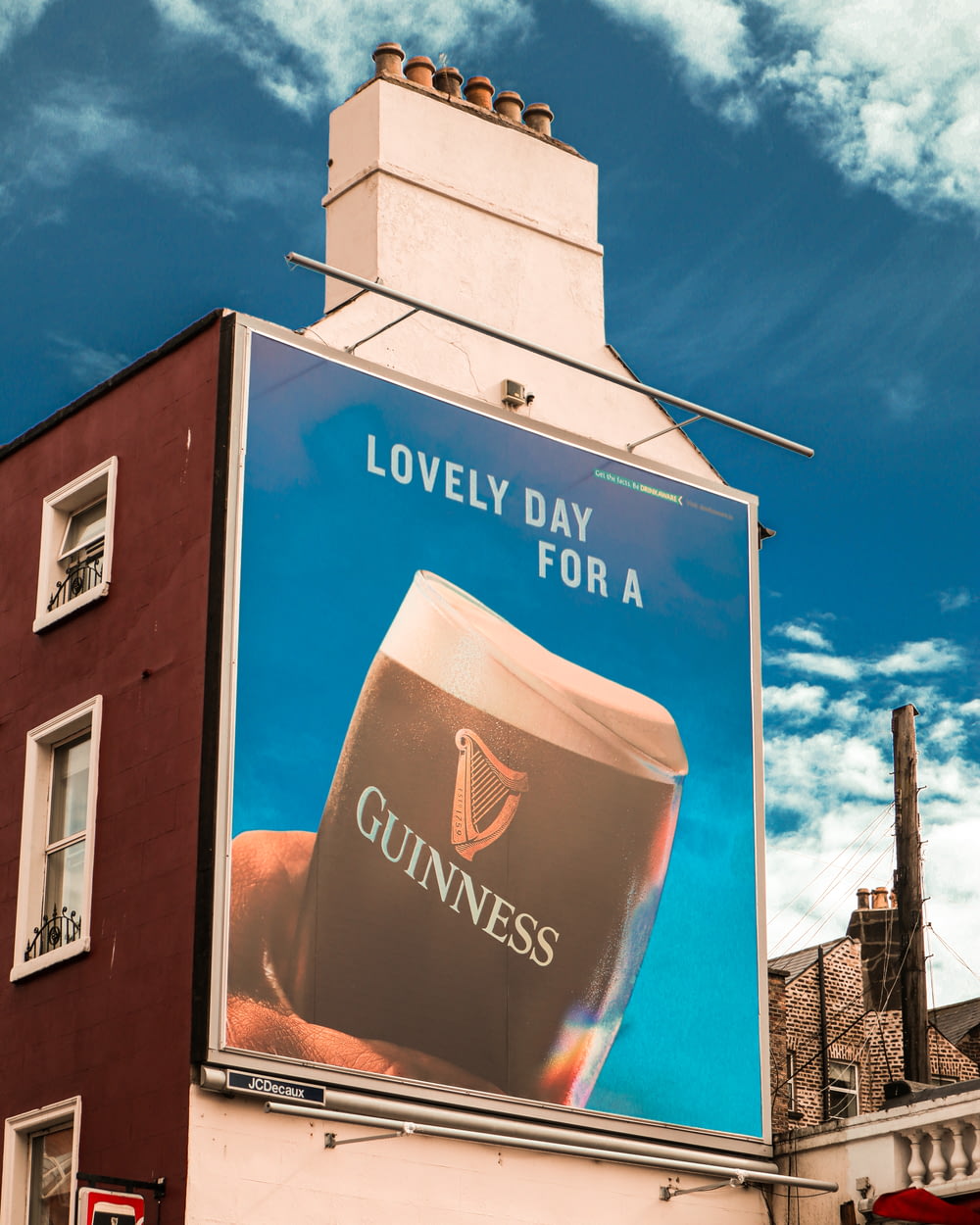 a large guinness advertisement on a building