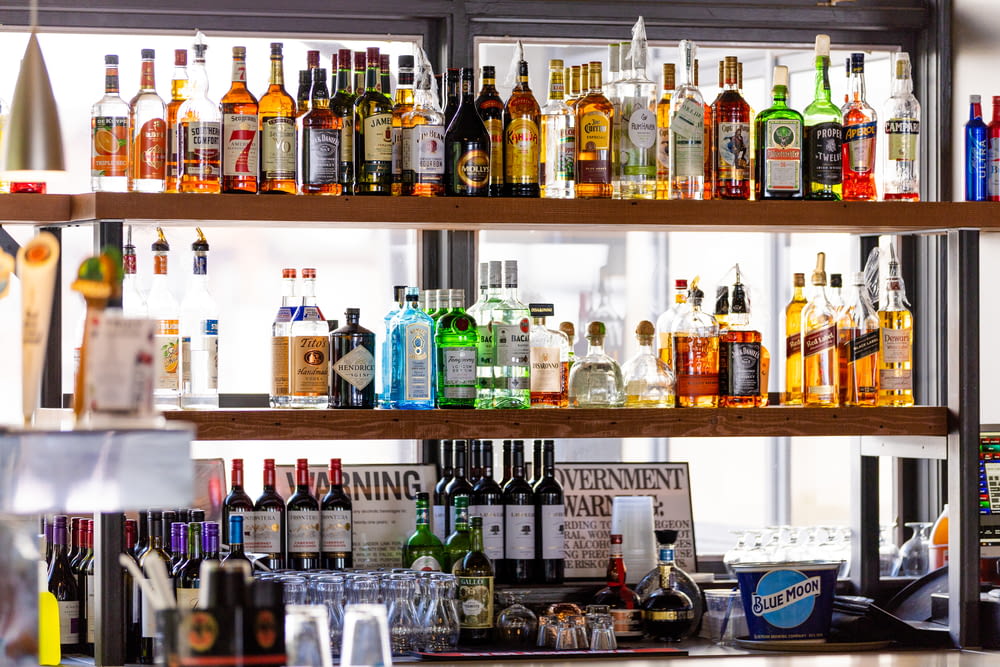 a bar filled with lots of bottles of alcohol