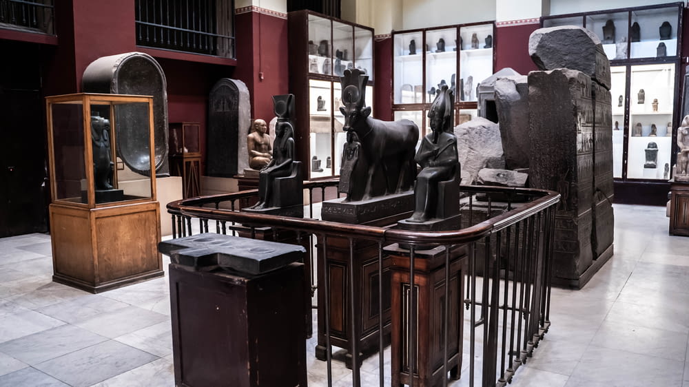 a room filled with lots of statues of animals