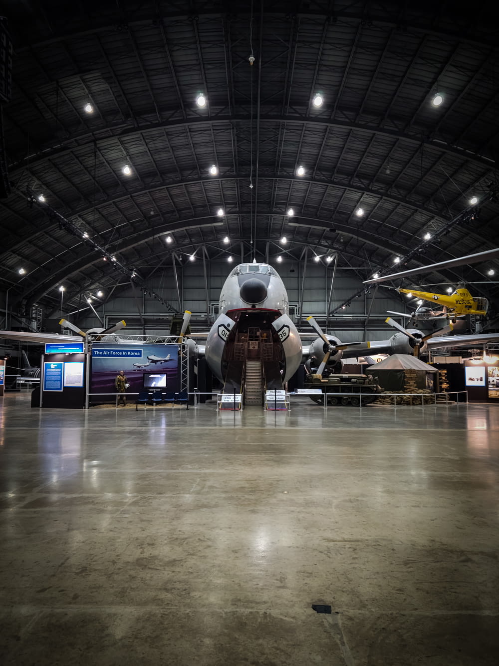 a large airplane is parked inside of a hangar