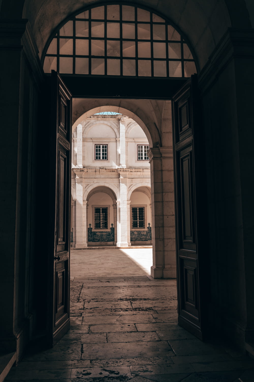 an open door leading to a large building