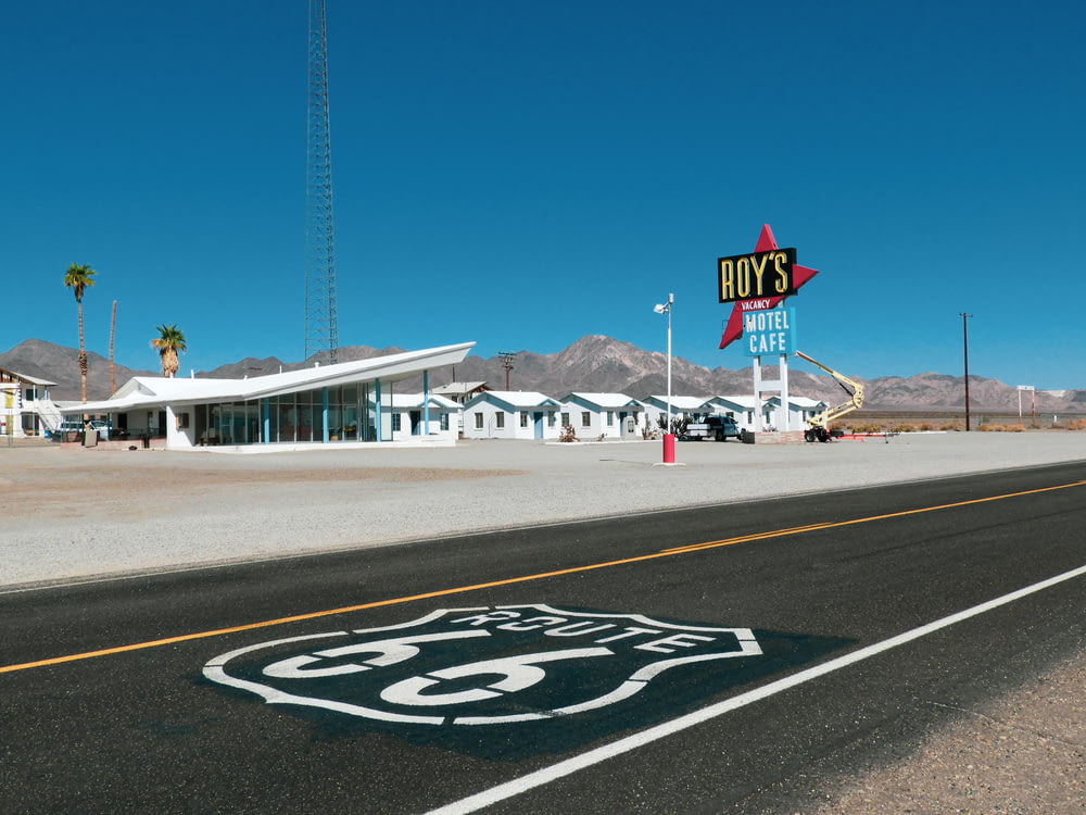 a route 66 sign on the side of a road