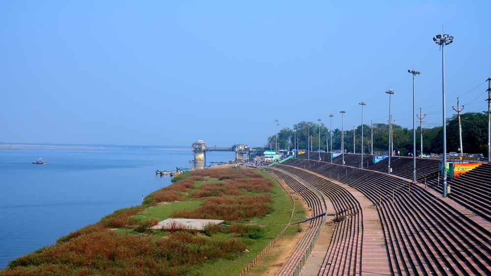 a train track next to a body of water