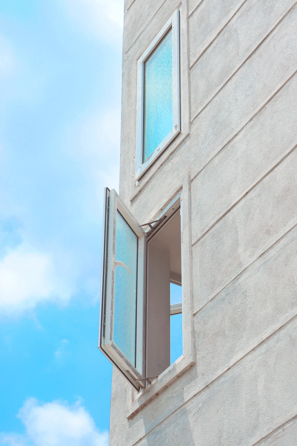 an open window on the side of a building