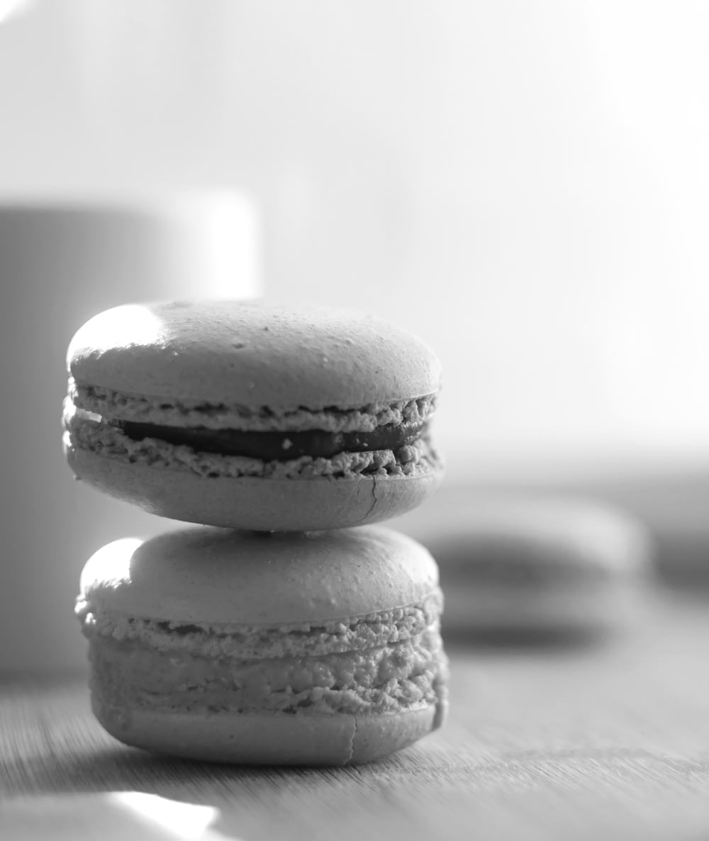 a black and white photo of two macaroons