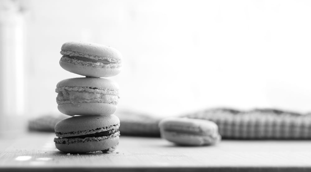 a stack of macaroons sitting on top of a table