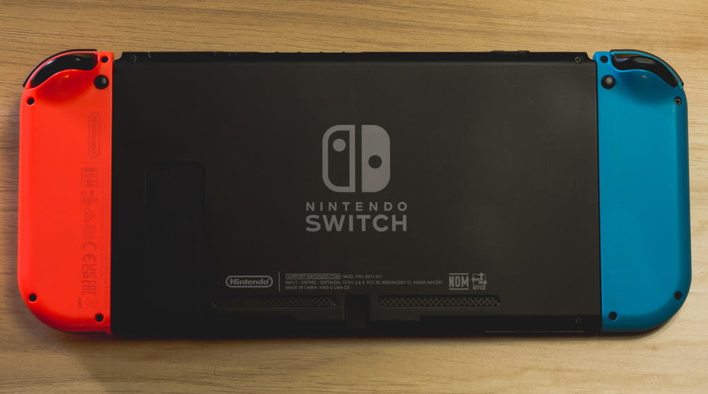 a nintendo switch sitting on top of a wooden table