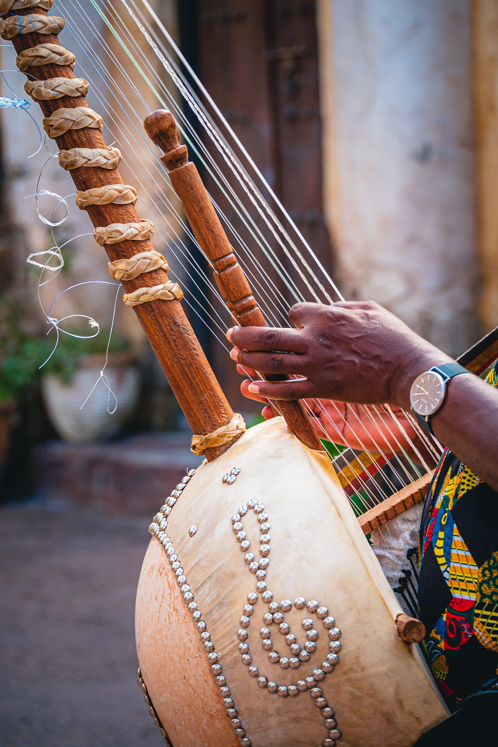 a close up of a person playing a musical instrument