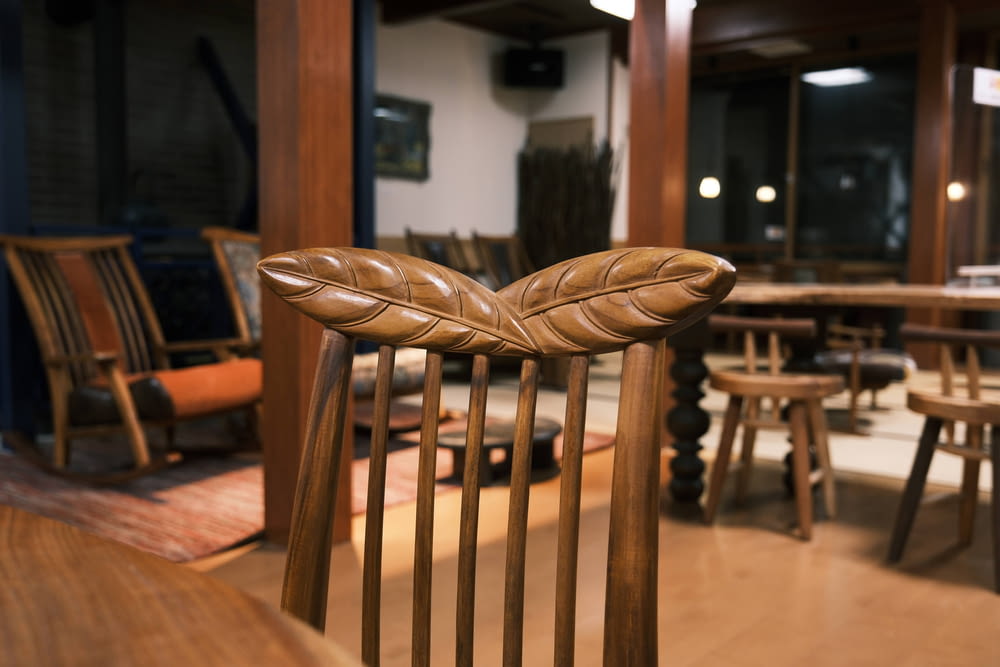 a close up of a wooden chair in a room