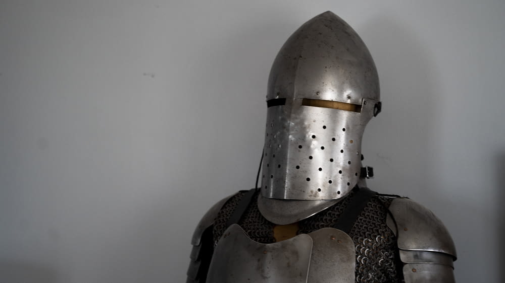 a close up of a knight's helmet and armor