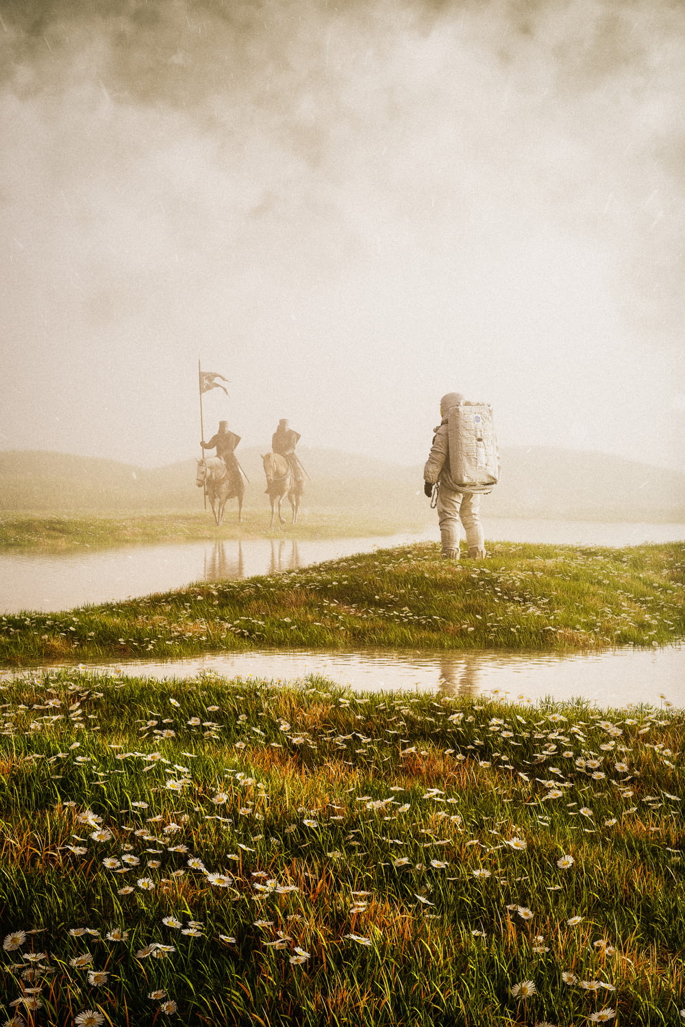 a group of people riding horses on a foggy day