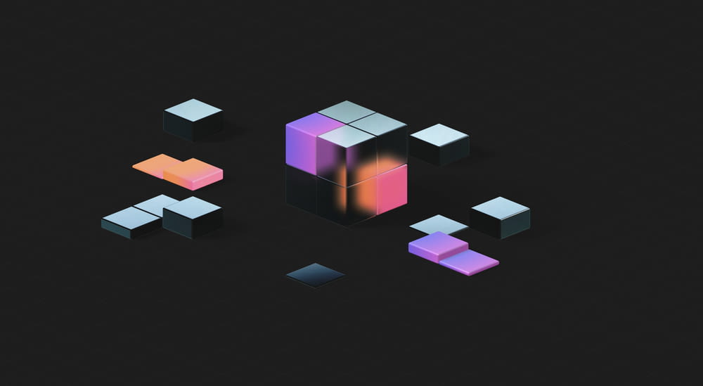 a black background with a pink and purple cube