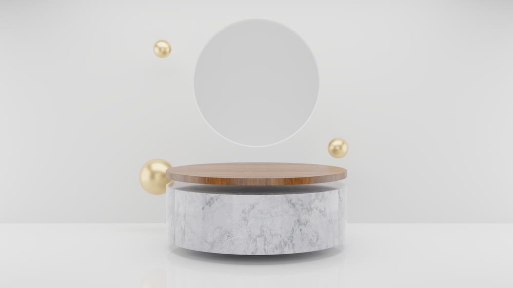白いテーブルの上に置かれた丸い鏡