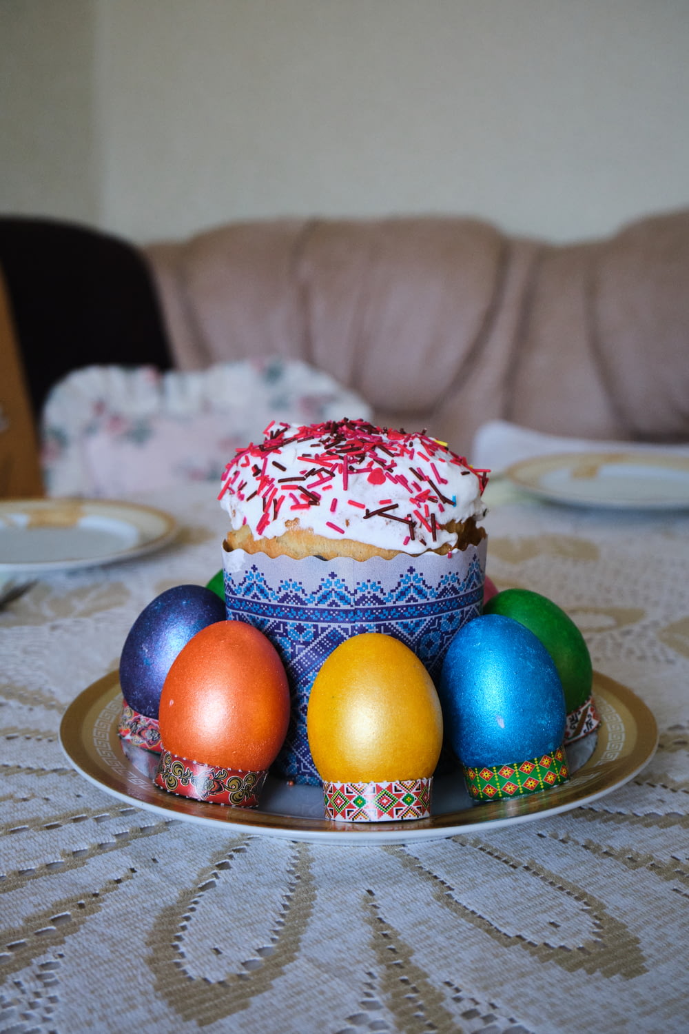a plate of decorated eggs on a table