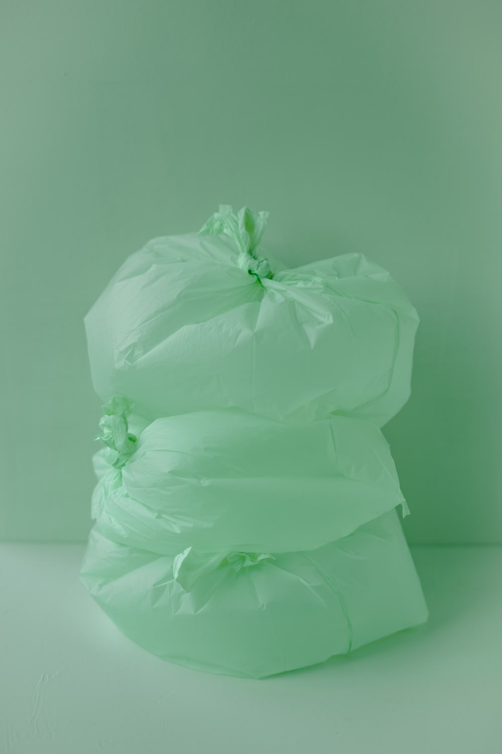 a stack of white bags sitting on top of a table