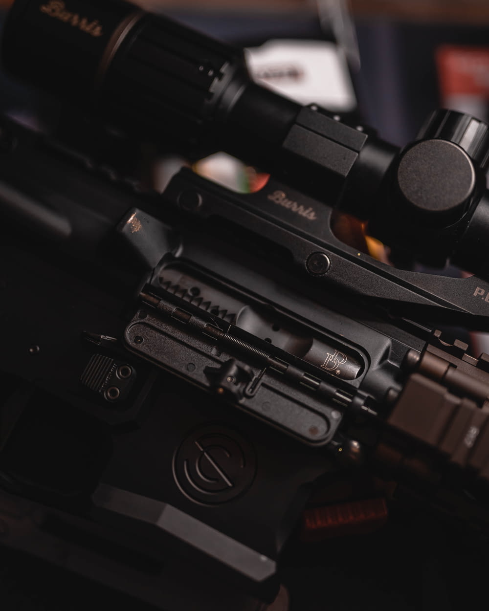 a close up of a rifle with a scope