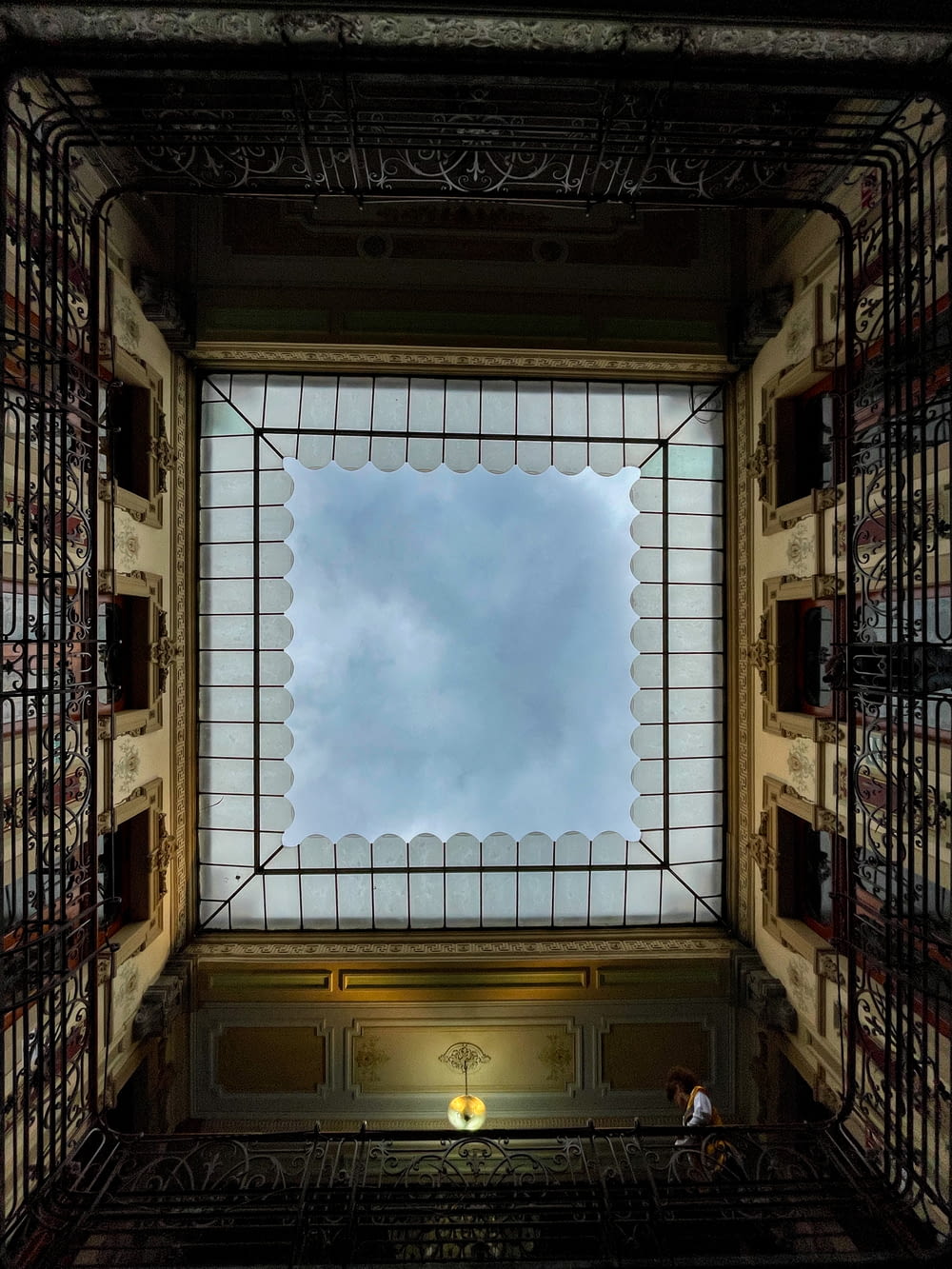 a view of the sky through a window in a building
