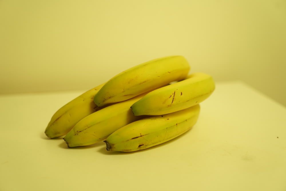 a bunch of bananas sitting on top of a table
