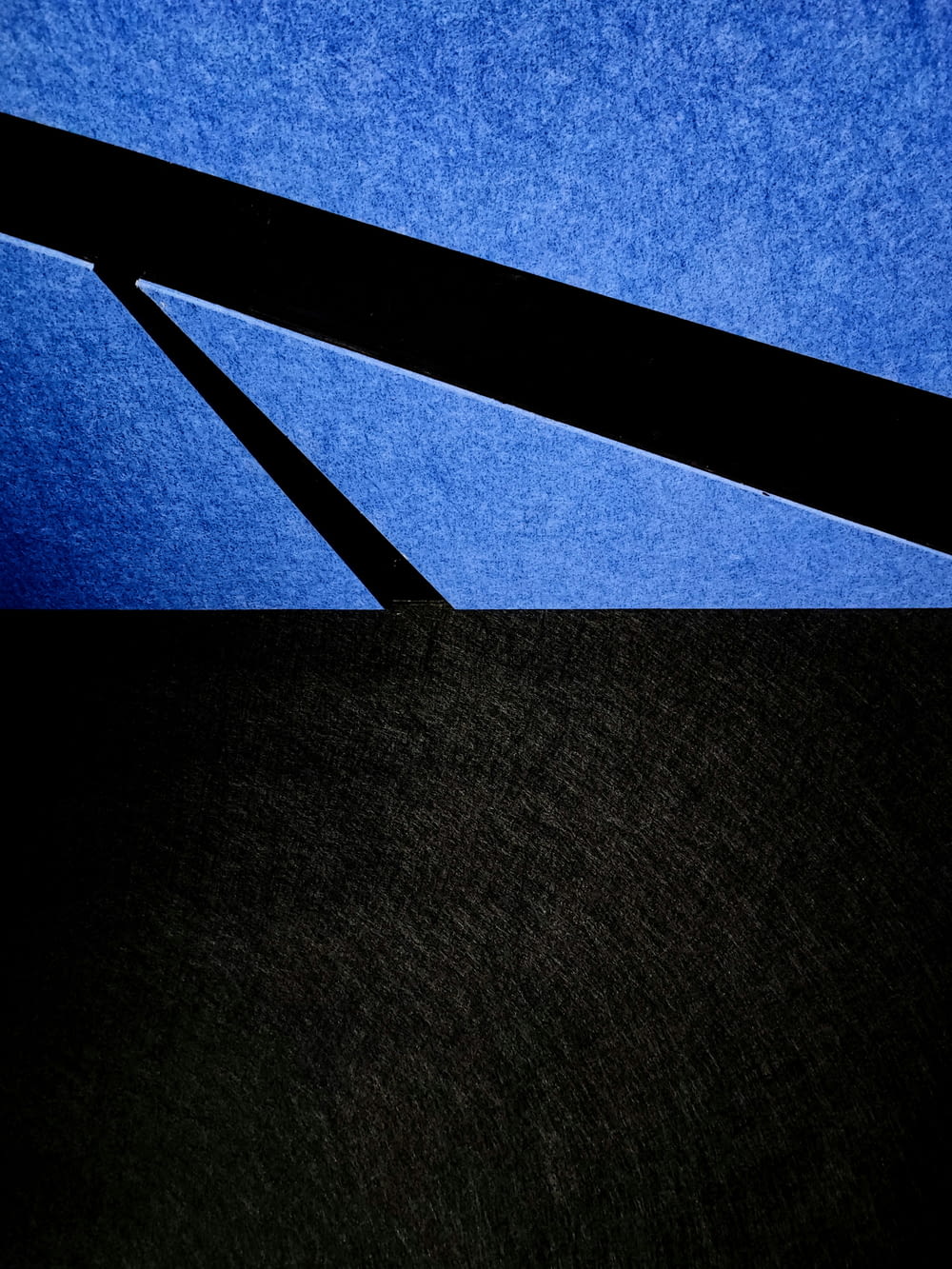 a close up of a black and blue background