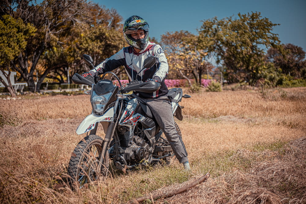 a person on a dirt bike in a field