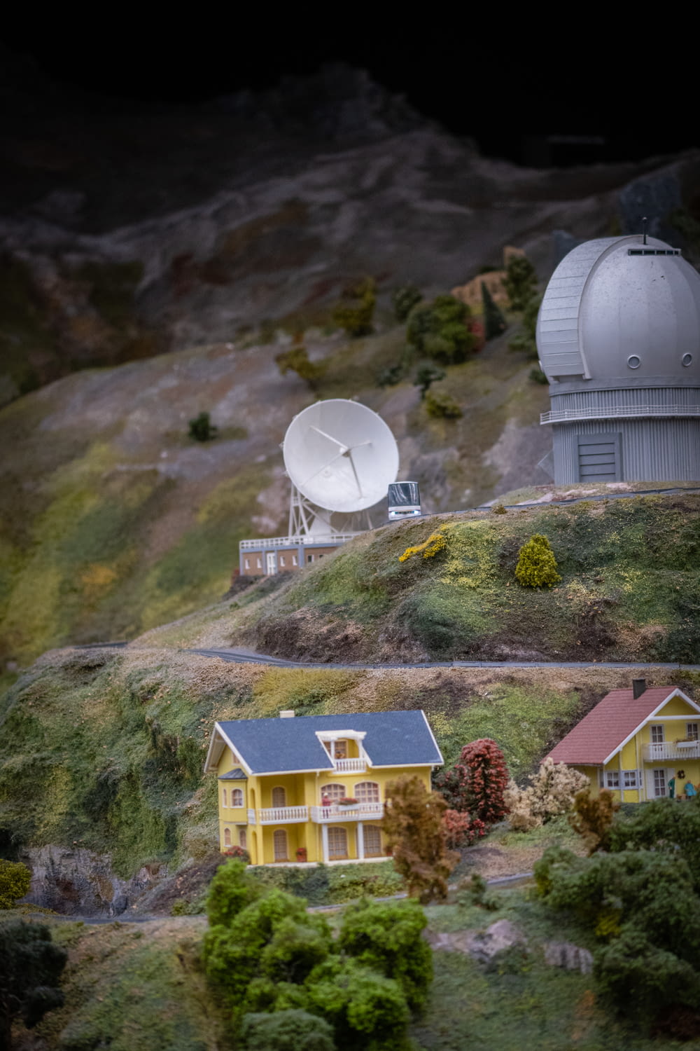 a model of a house with a satellite dish on top of it