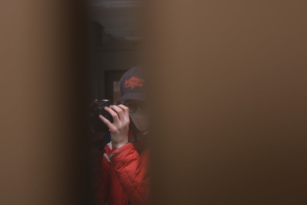 a person taking a picture of themselves in a mirror