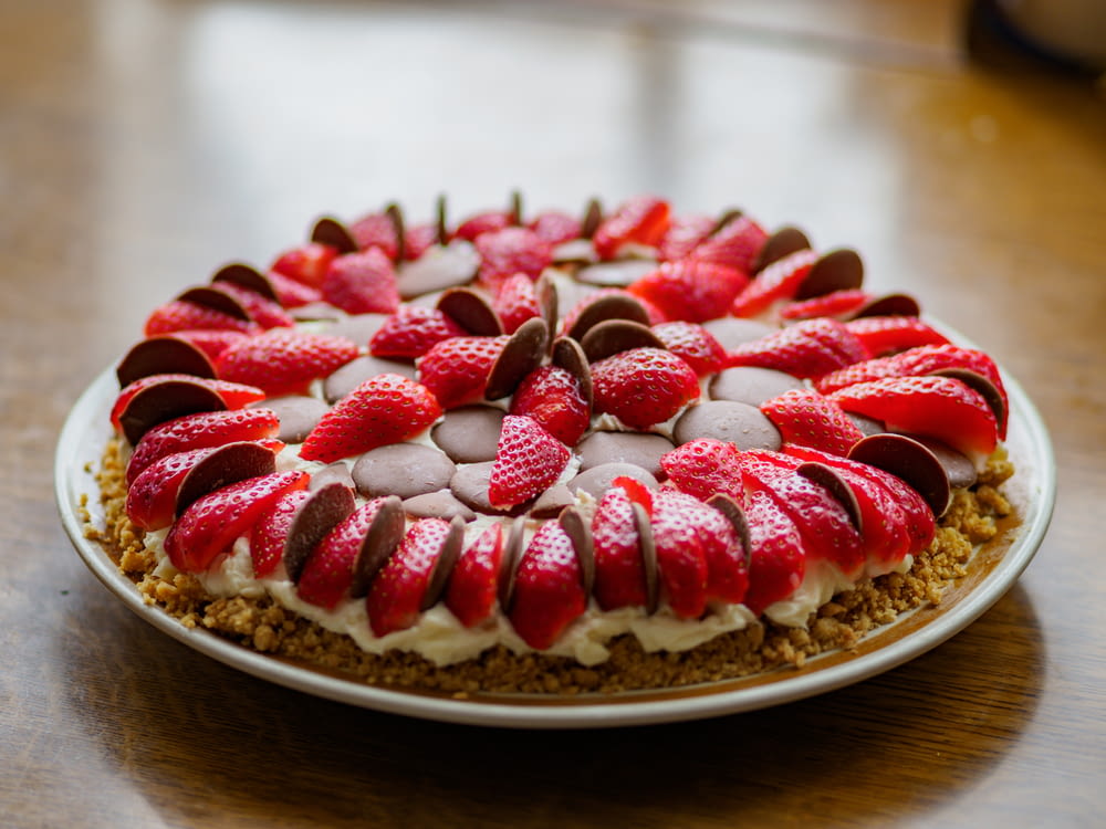 a cake with strawberries and chocolate on top