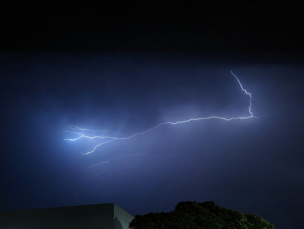 a lightning bolt hitting a building at night