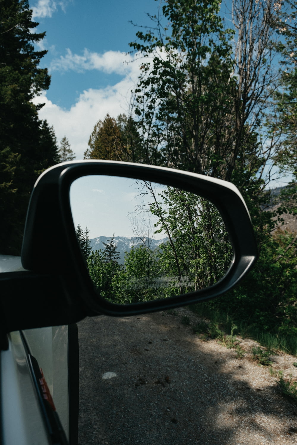 a rear view mirror on a car on a road