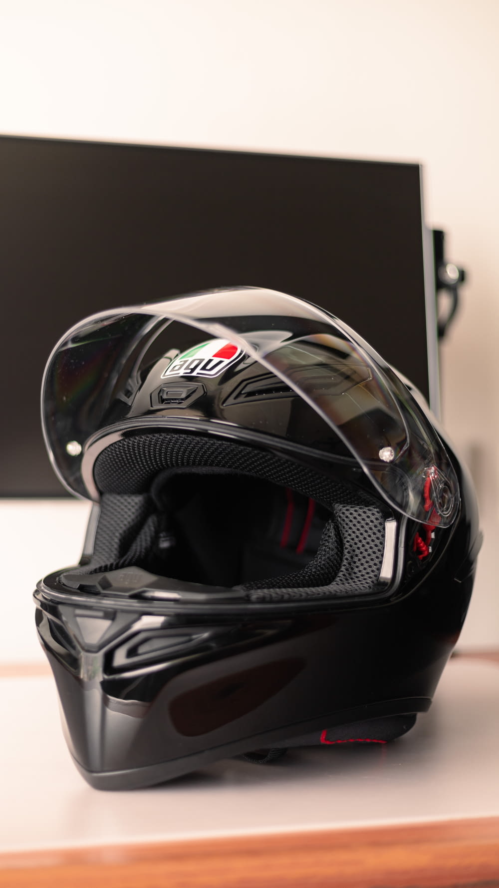 a motorcycle helmet sitting on top of a wooden table