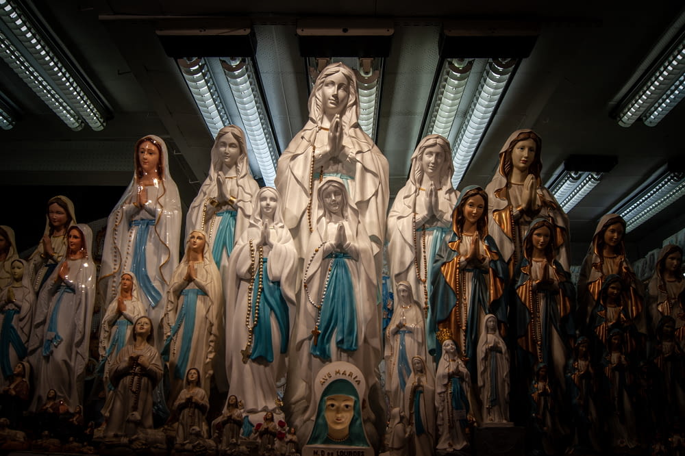 a group of statues of the virgin mary and jesus