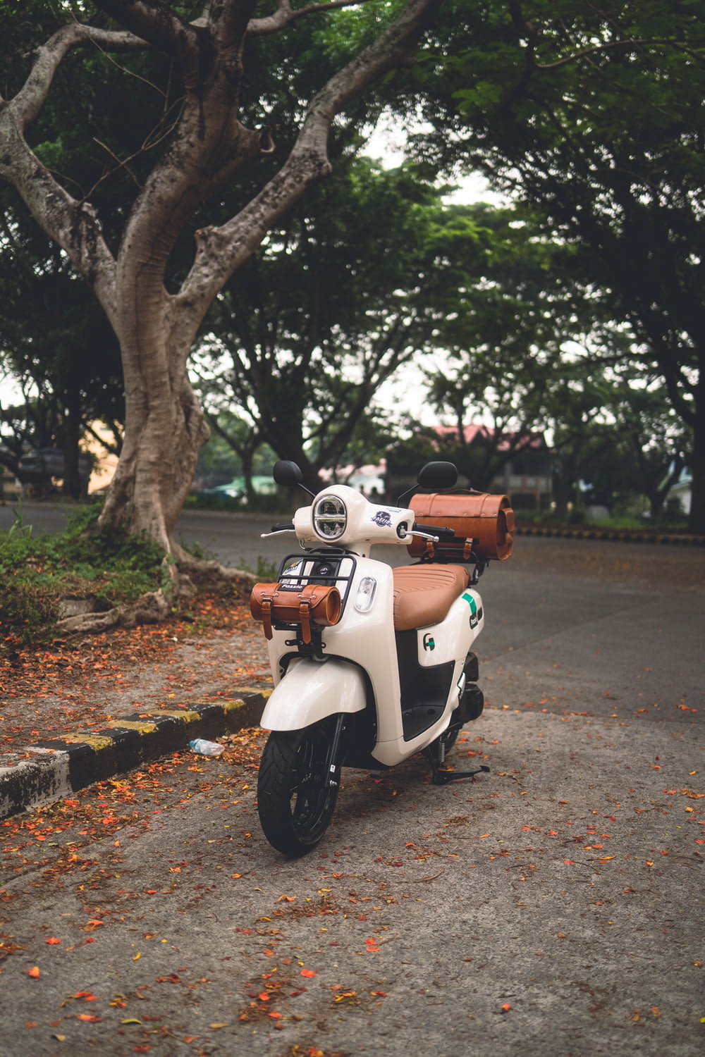 a motor scooter parked on the side of a road