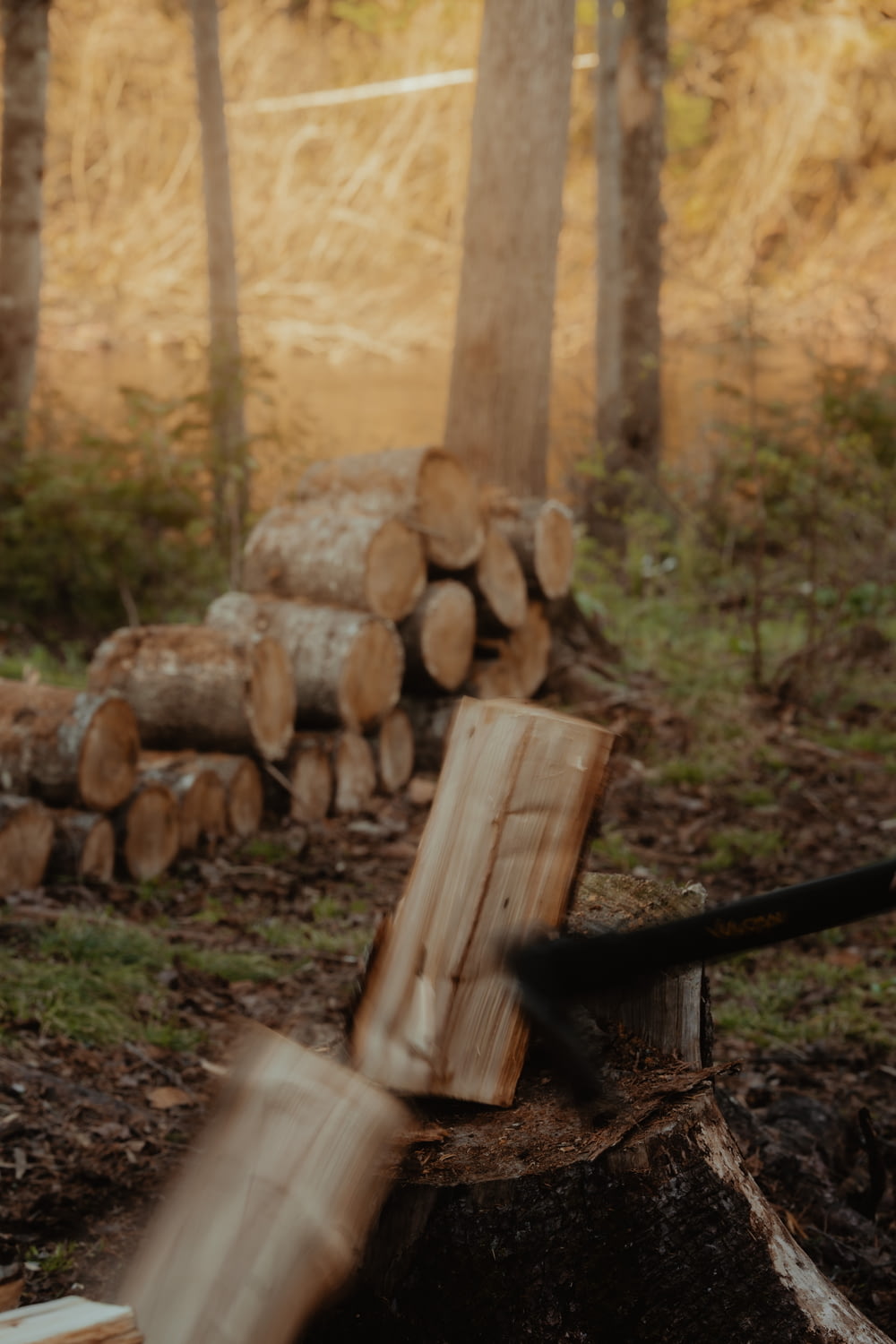 a person chopping wood with a large axe