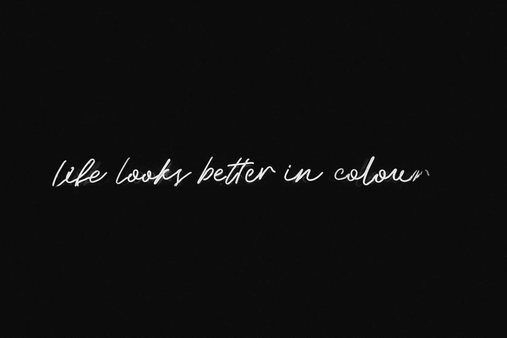 a black and white photo with the words life looks better in color