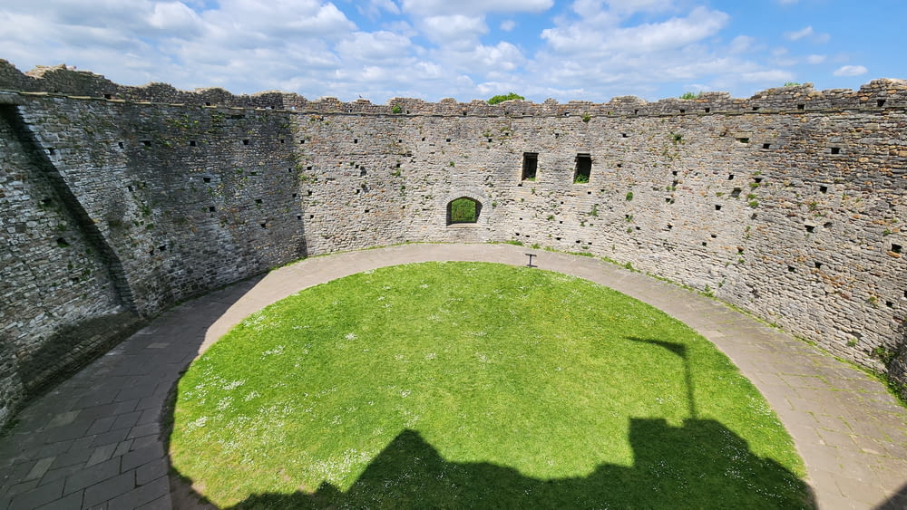 a shadow of a person standing in front of a castle