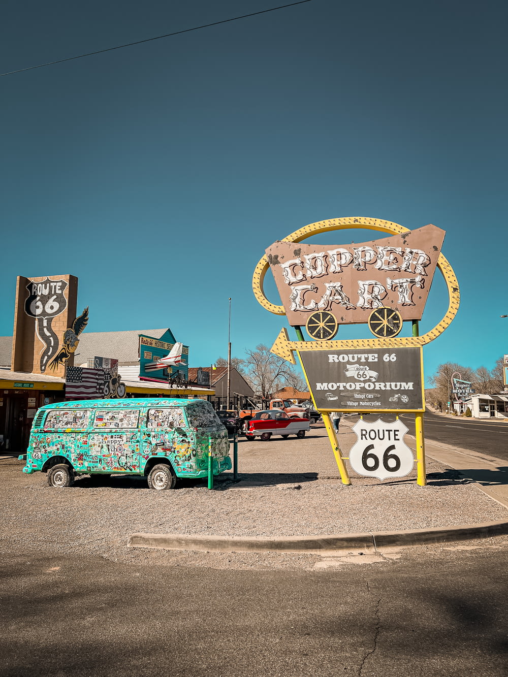a van parked in front of a sign for a route 66