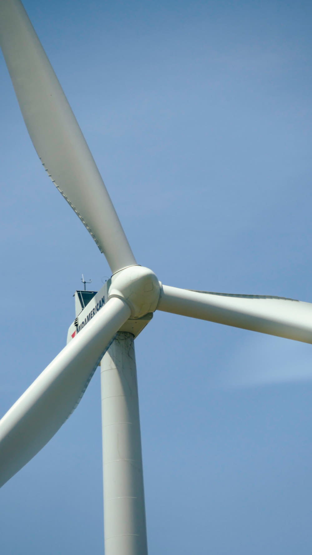a close up of a wind turbine on a clear day