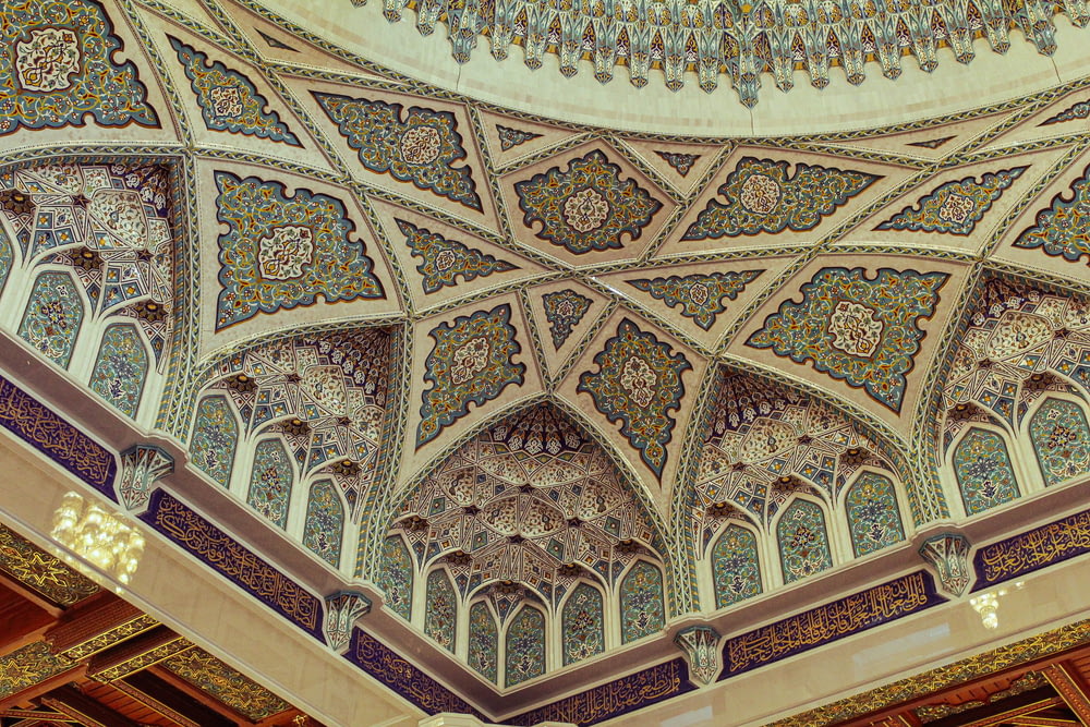 a ceiling in a building with intricate designs