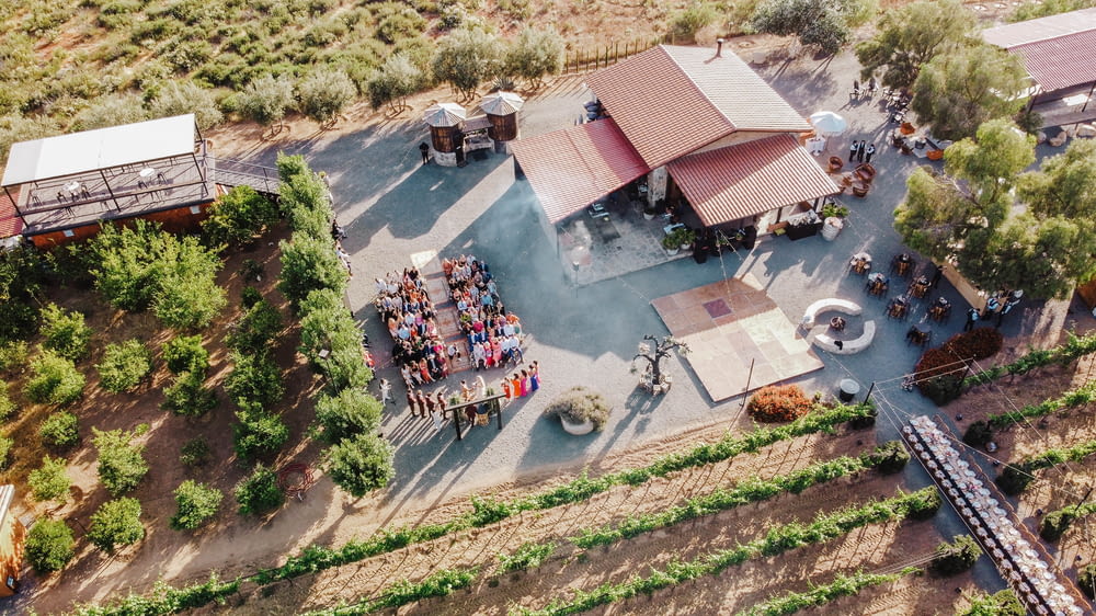 an aerial view of a farm with a crowd of people