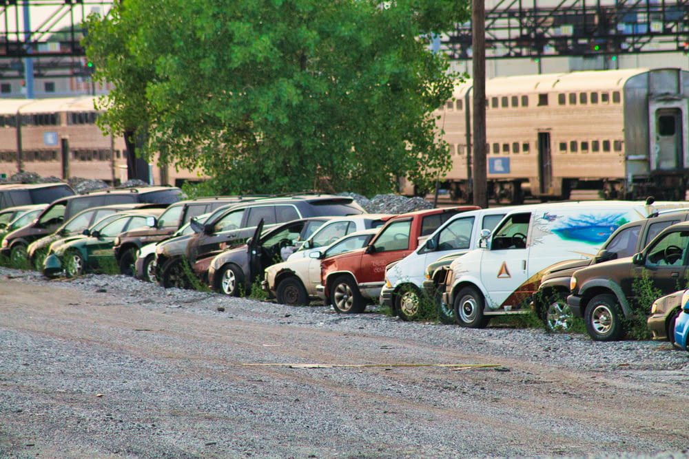 a row of parked cars sitting next to each other